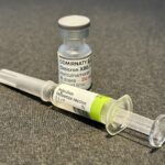 Vaccine vial and syringe prepared for injection
