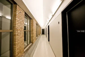 A data centre corridor lined with storage and server cabinets.