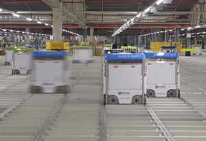 autonomous robots moving shelves in a warehouse